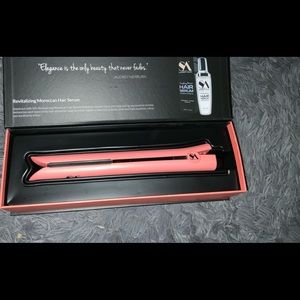 New, unused pink Straight Ahead flat iron.